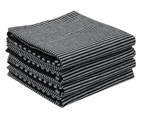 Multiple layers of black and white striped rectangular dish towels