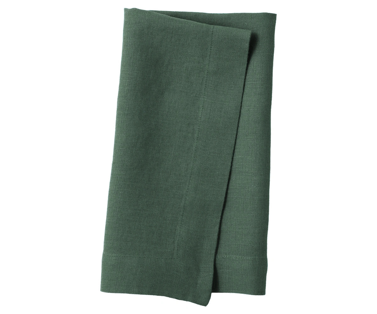 Evergreen linen napkin with deep green shade, neatly folded for dining decor