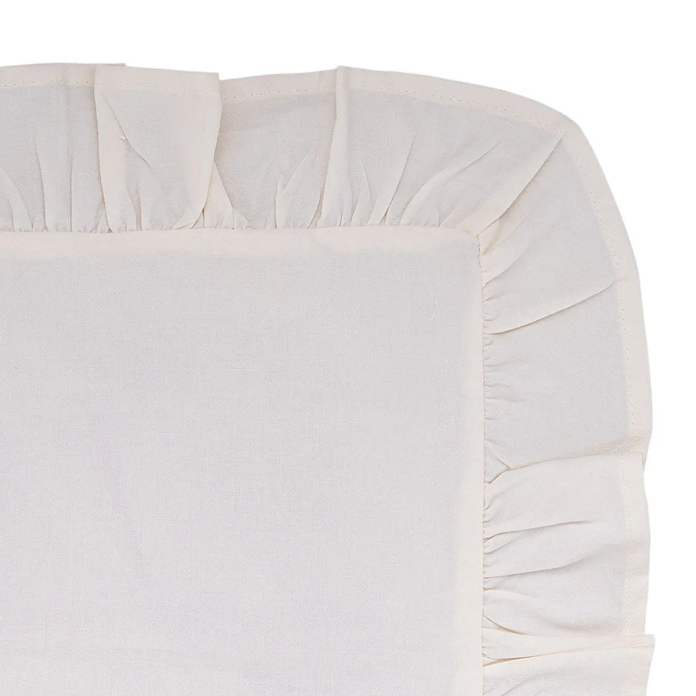 Natural cotton napkins styled with a round tablecloth for a rustic wedding setup.