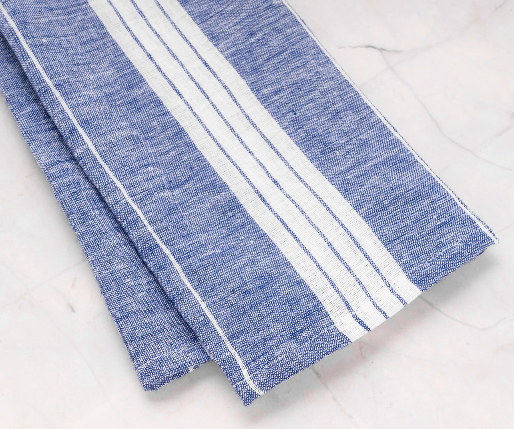 Blue and white striped linen tea towels for drying dishes and lining bread baskets
