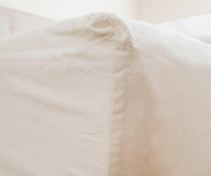 Cotton percale king fitted sheet offers a crisp, breathable feel for a restful night’s sleep.