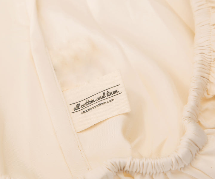 100% cotton fitted queen sheet provides a soft, breathable option for queen-sized beds.