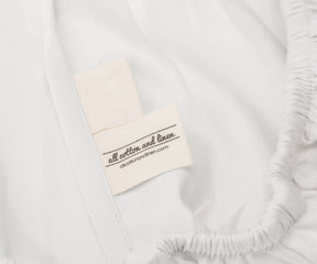 Label on a white cotton fitted sheet