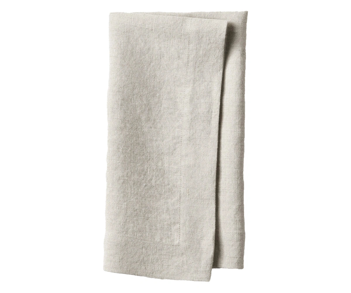 Natural flax plain linen napkin highlighting rustic beige tone and sustainable fabric texture