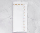 Rich gold-colored napkins, enhancing the elegance of any dining arrangement with their soft texture.