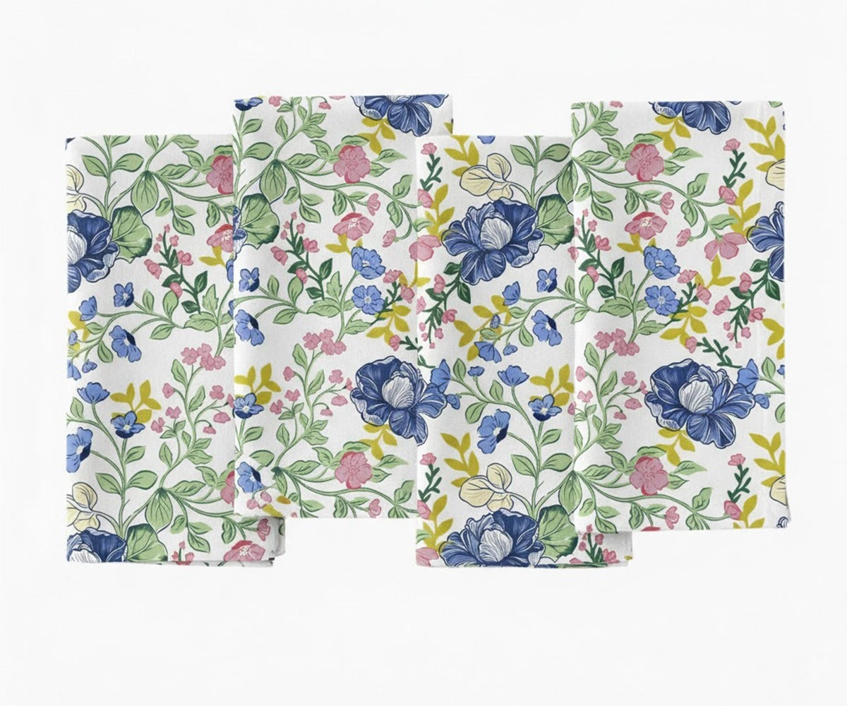 Multicolor floral printed cotton napkin with blue, pink, and yellow flowers.