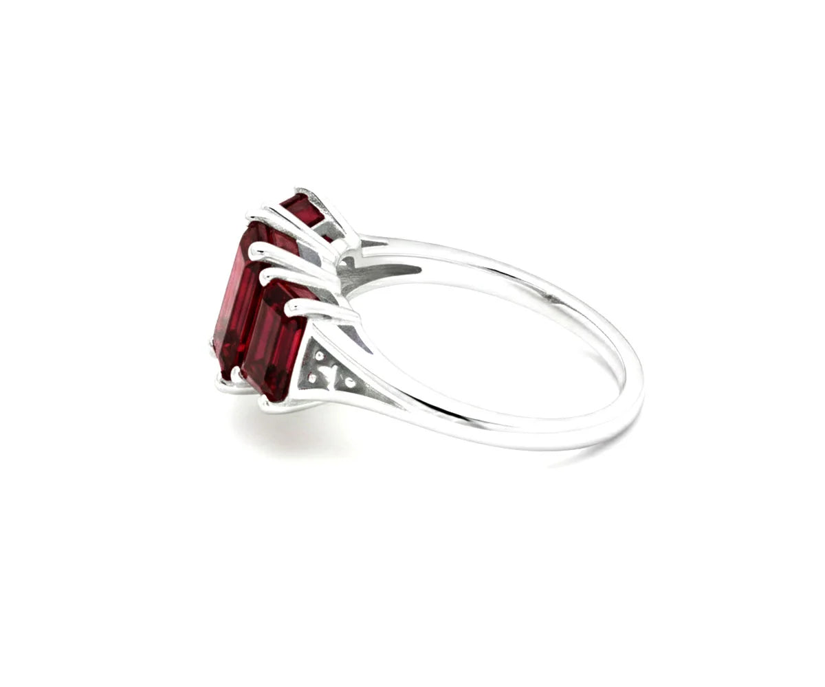 Red gemstone garnet ring with zircon accents in stylish design