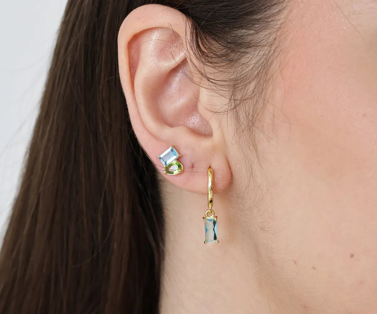 Classic hoop earrings with a dangling geometric stone