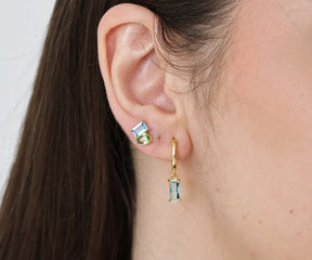 Classic hoop earrings with a dangling geometric stone