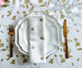 farmhouse napkins can be coordinated with other gold-themed elements such as tablecloths