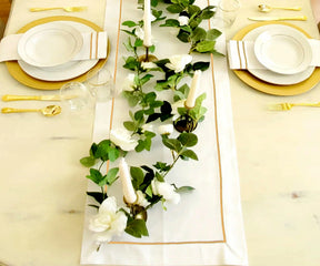 Luxurious white napkins with intricate embroidery lines, ideal for creating a refined dining experience.