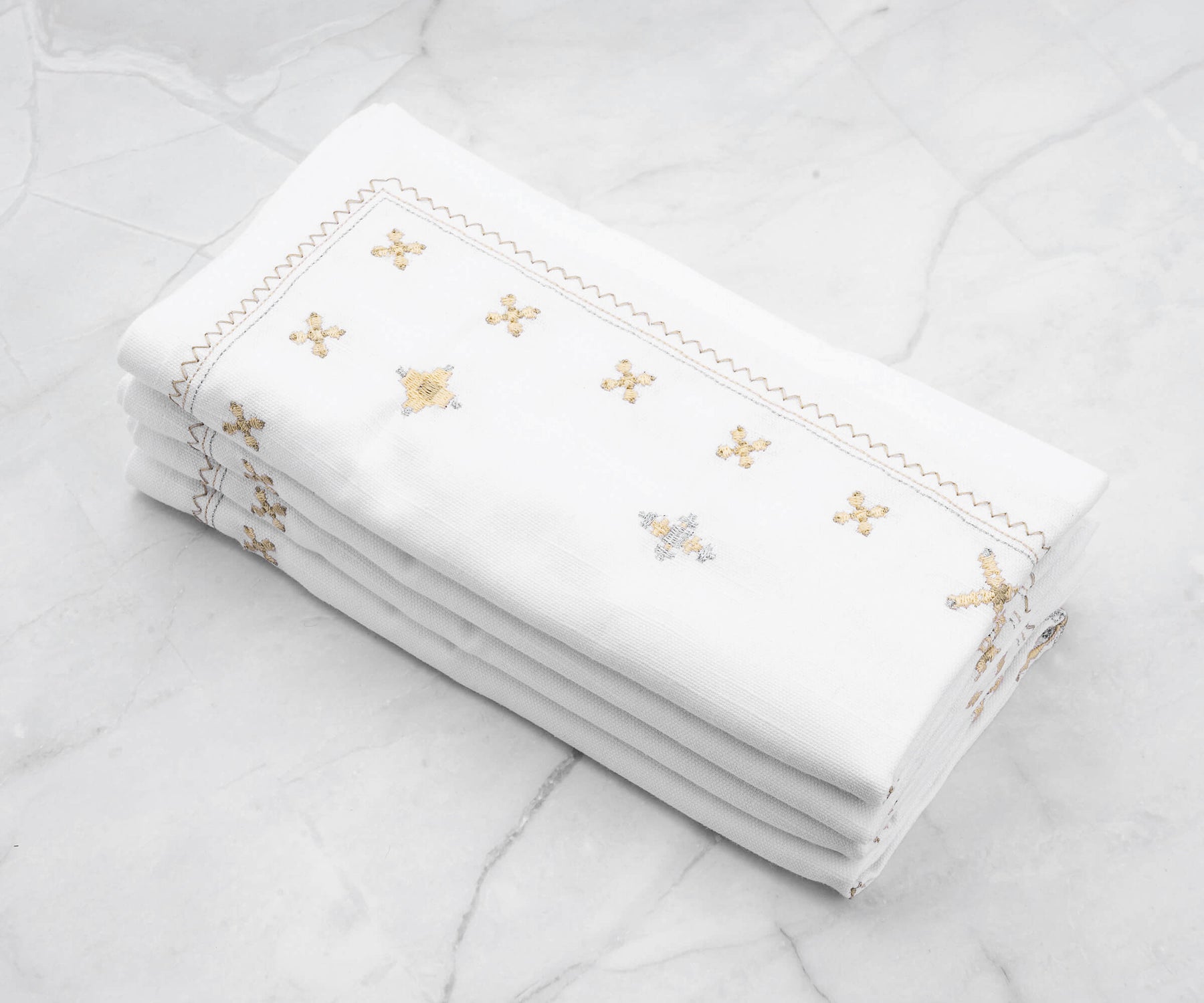 emstitching: Some embroidered napkins feature hemstitched borders or edges, enhancing the overall aesthetic appeal and providing a finished look.