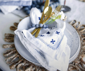 White dinner napkins Disposable napkins offer convenience and easy cleanup.