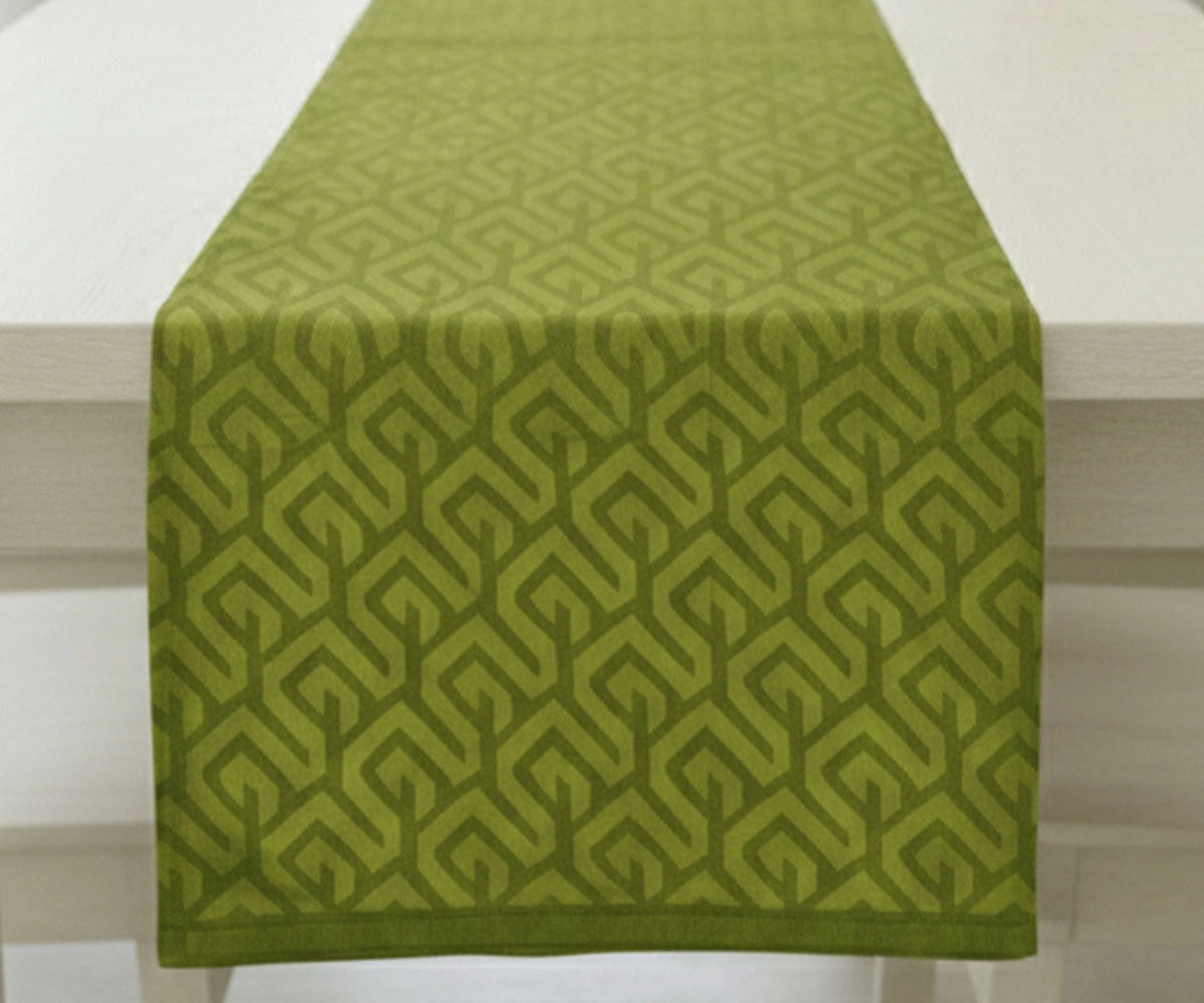 Green tablecloth with geometric zigzag pattern on a table