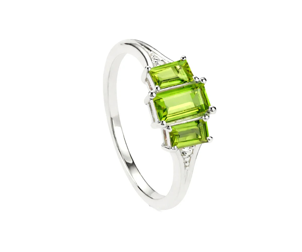 Peridot ring with white zircon stones in elegant design