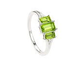 Peridot ring with white zircon stones in elegant design