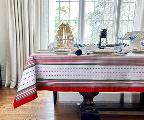 Red Striped Tablecloths provide a protective layer for dining tables, helping to prevent damage from hot dishes, spills, and scratches. 