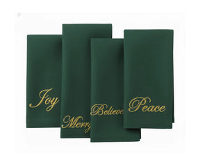 Festive green embroidered cotton napkins featuring holiday-inspired words, perfect for winter dining, family gatherings, and seasonal décor