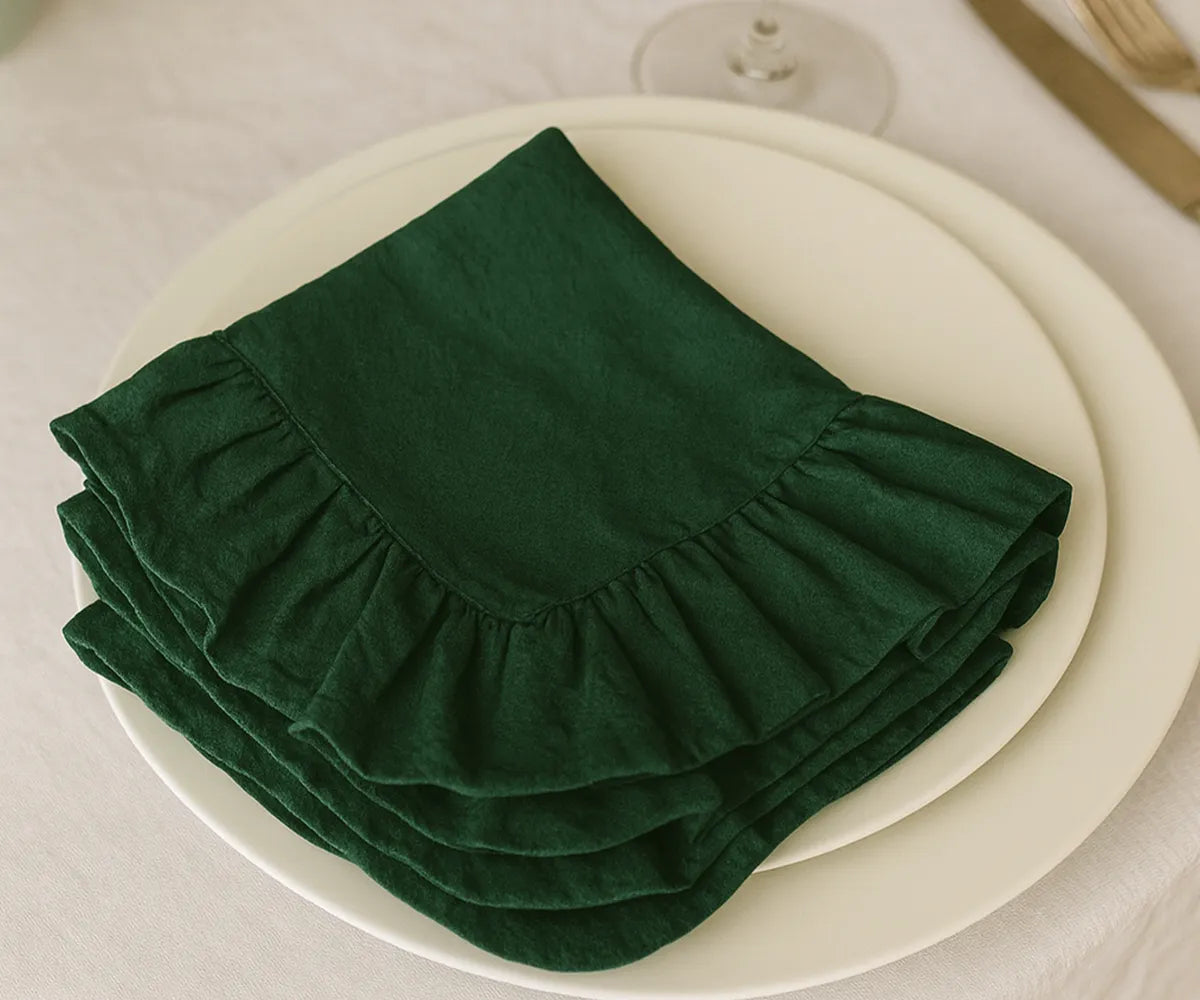 Green cotton ruffle edge cloth napkins, soft and reusable fabric dinner napkins in multiple sizes, perfect for weddings, parties, casual dining, and sustainable farmhouse table décor.