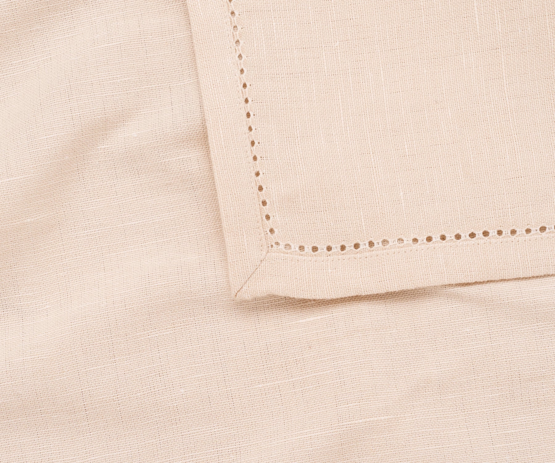 Natural-colored hemstitch napkins styled with neutral dinnerware