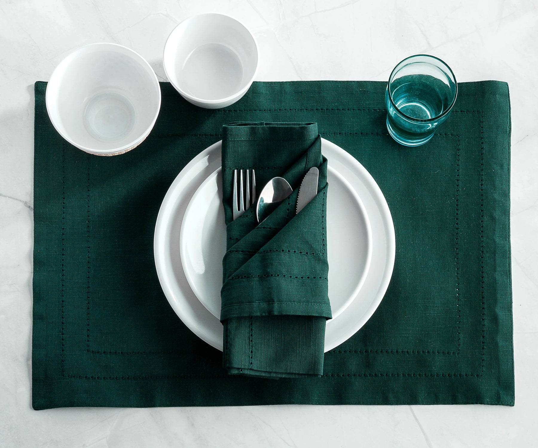 Set of 6 Forest Green hemstitch napkins neatly arranged