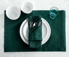 Set of 6 Forest Green hemstitch napkins neatly arranged