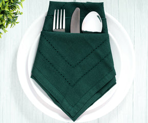Forest Green cotton dinner napkins folded on a table