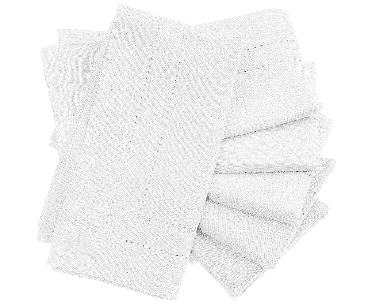 Set of white napkins with decorative edge on a white background