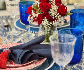 Festive table setting with red, white, and blue cloth napkins and tableware