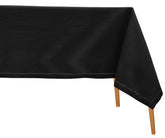Black tablecloth on a wooden table with a white background