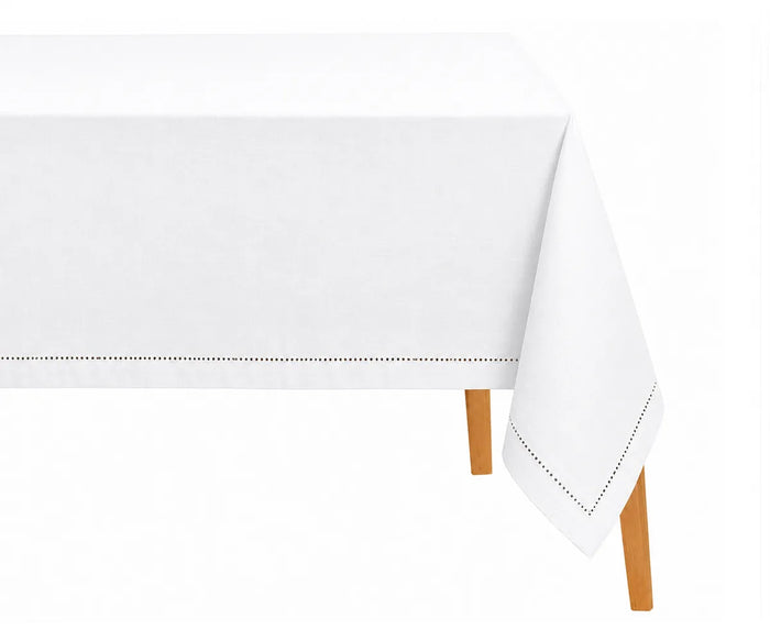 White tablecloth on a wooden table with a white background