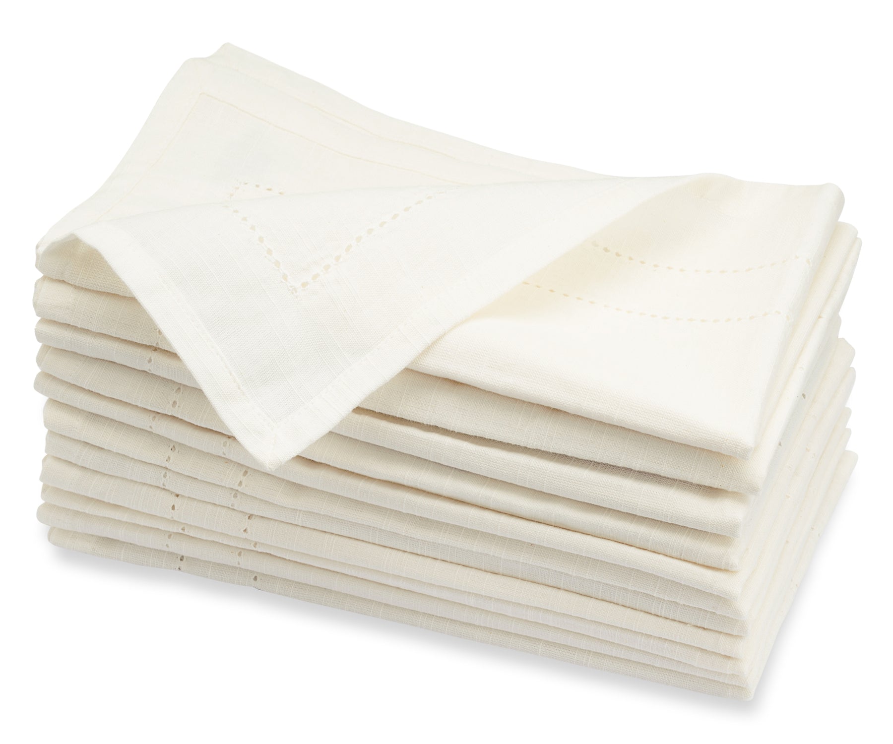 Multiple white cloth dinner napkins stacked against a pure background