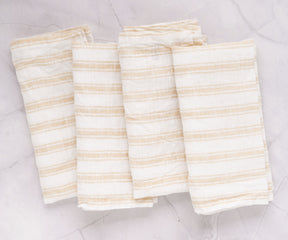 Neutral beige napkins, versatile and timeless, bring a warm and inviting feel to your dining experience.