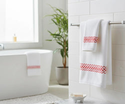 Luxurious white bath towel with red embroidery, available in multiple sizes, soft, durable, and machine washable for everyday bathroom use.