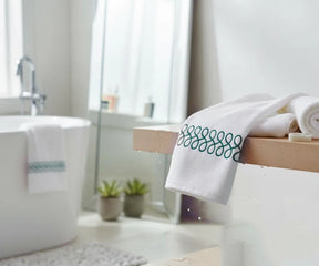 Luxury white and green embroidered bath towels made from 100% premium cotton