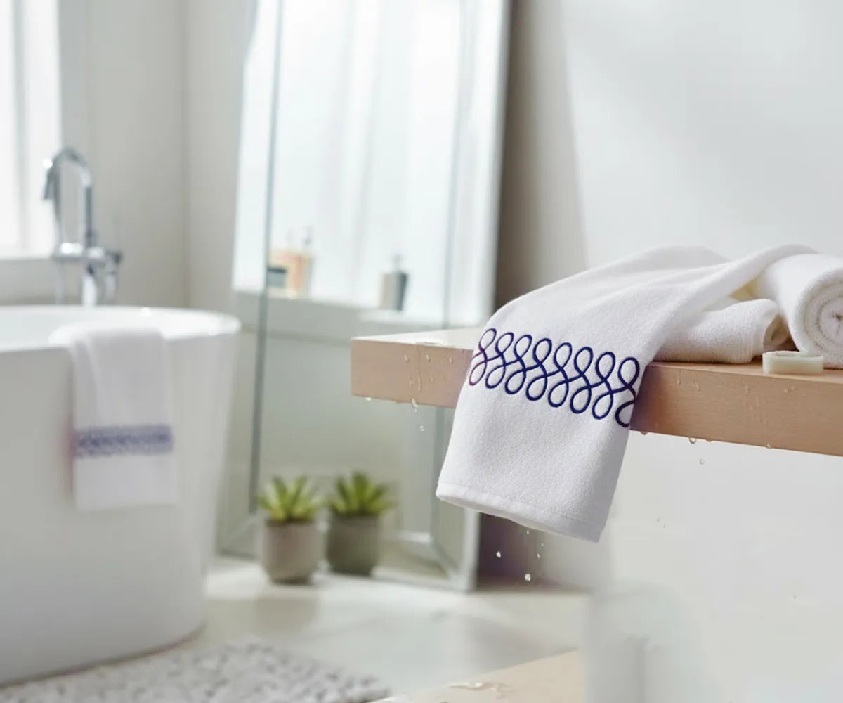 Luxury navy and white embroidered bath towels made from 100% premium cotton