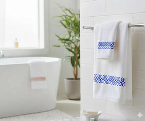 Soft 100% cotton bath towel with royal blue embroidered border for elegant bathroom décor