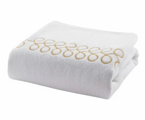 Luxury cotton bath towels in white with beige embroidery for elegant bathroom décor