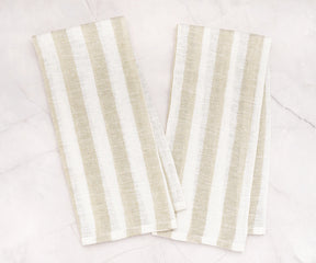 Striped linen tea towel hanging on oven handle
