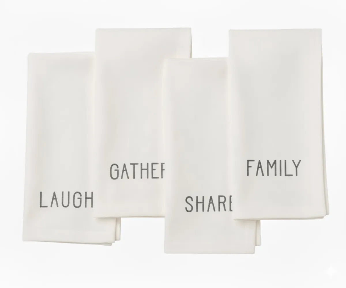 Ivory embroidered cotton napkin with white stitching — minimalist dinner napkin for modern rustic table settings.