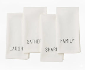 Ivory embroidered cotton napkin with white stitching — minimalist dinner napkin for modern rustic table settings.