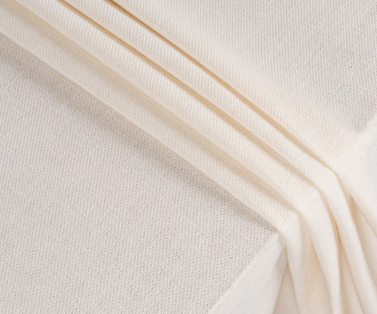 Ivory rectangular cotton tablecloth covering a banquet table, creating a refined and timeless look for weddings, parties, or special occasions.