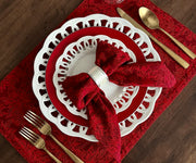 The rich, deep hue of red cloth napkins exudes a sense of classic elegance, adding a touch of sophistication to any table arrangement.