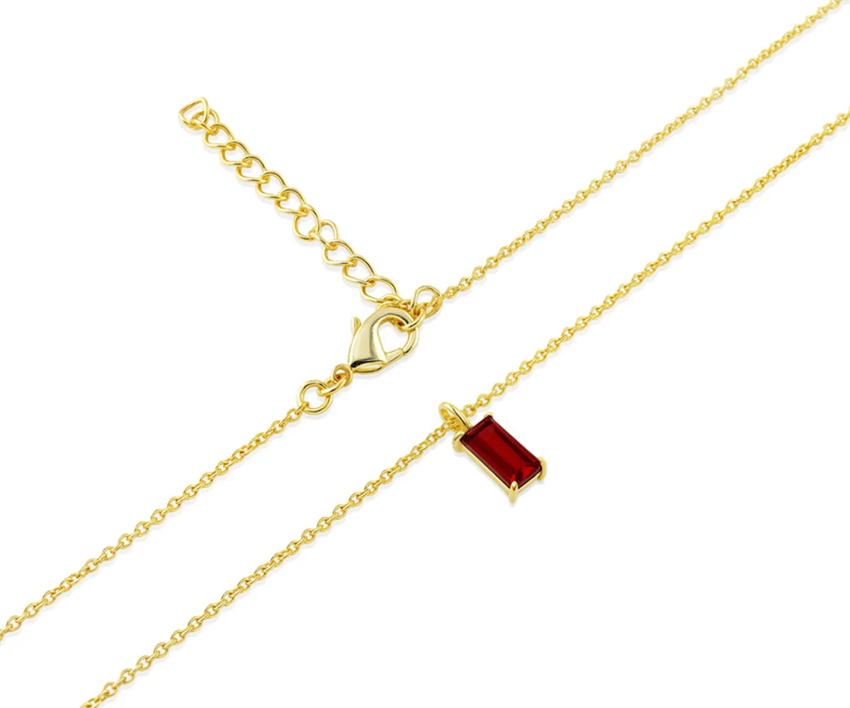 Close-up of July birthstone ruby pendant in rectangle design
