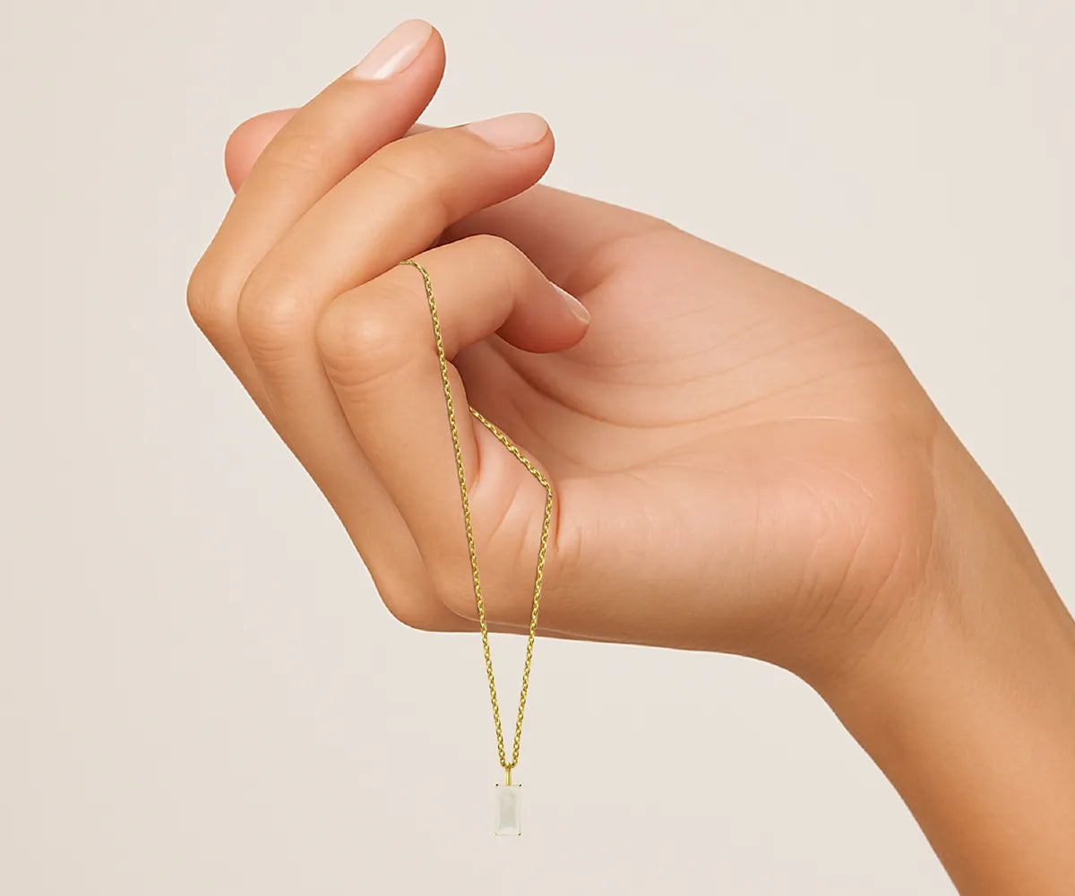 Light alexandrite-inspired pendant necklace with gold finish – June birthstone jewelry.