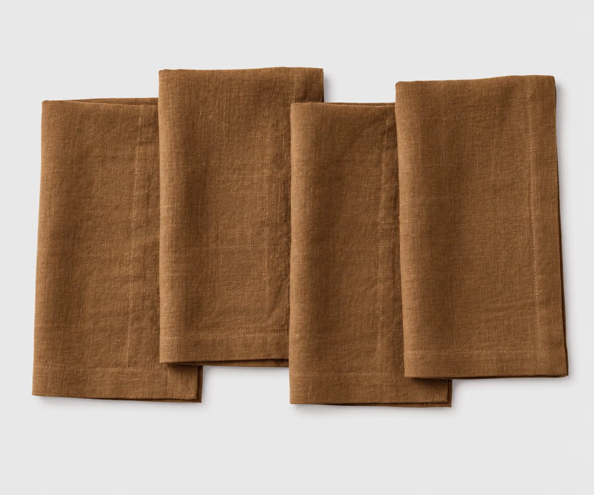 Four brown napkins on a white background