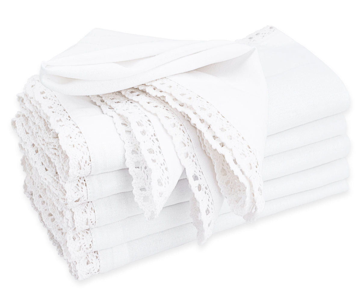 Delicate lace napkins, intricately designed, add an elegant and romantic flair to your formal dining setting.