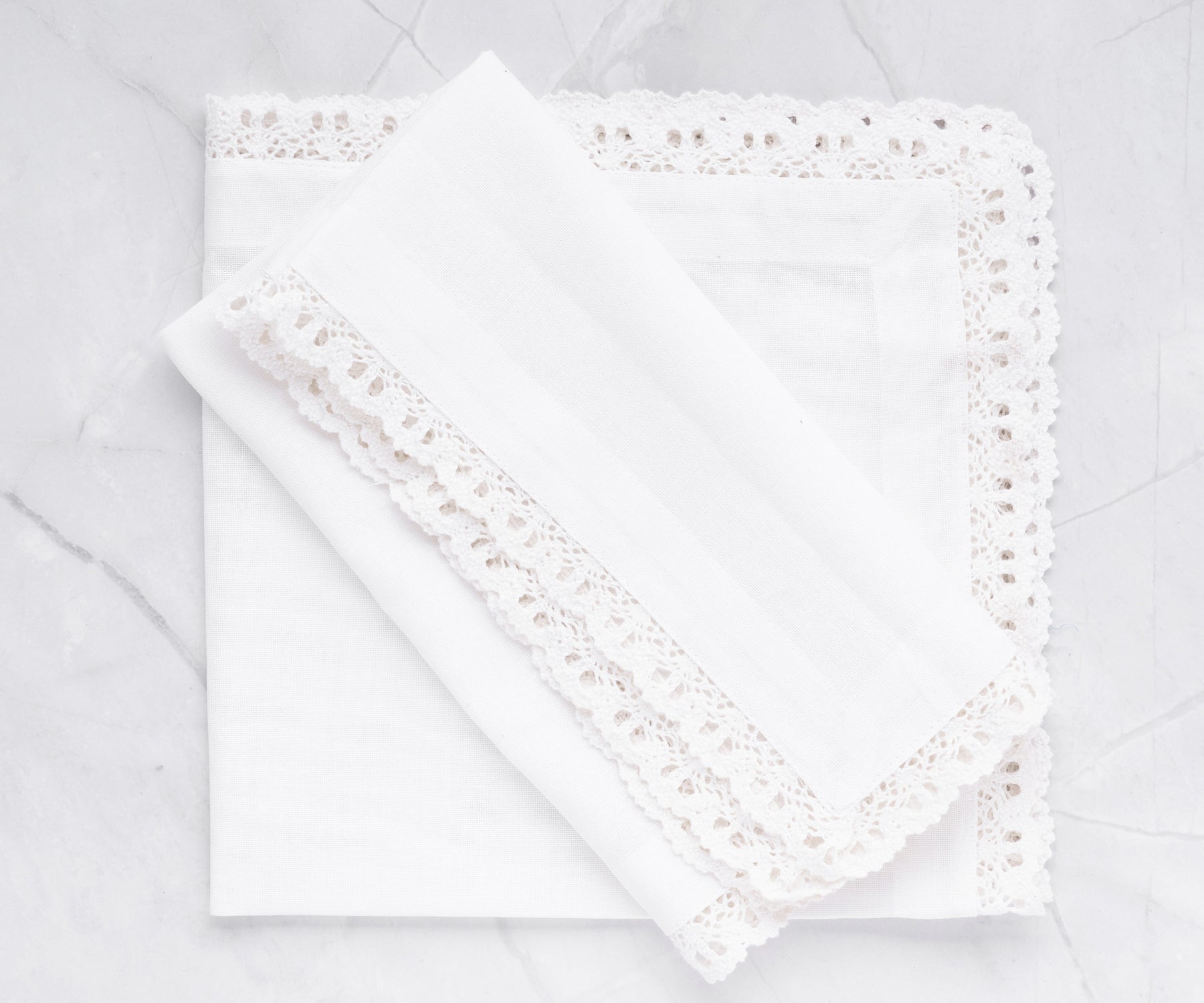 Set of 6 white cotton napkins, a versatile and practical solution, effortlessly elevates your table decor.