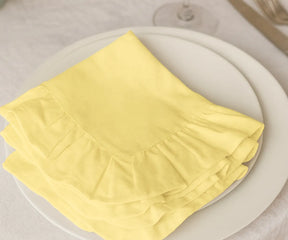 Set of 100% cotton yellow ruffled napkins, washable and eco-friendly fabric dinner napkins available in bulk or small sets, perfect for everyday dining and festive occasions.