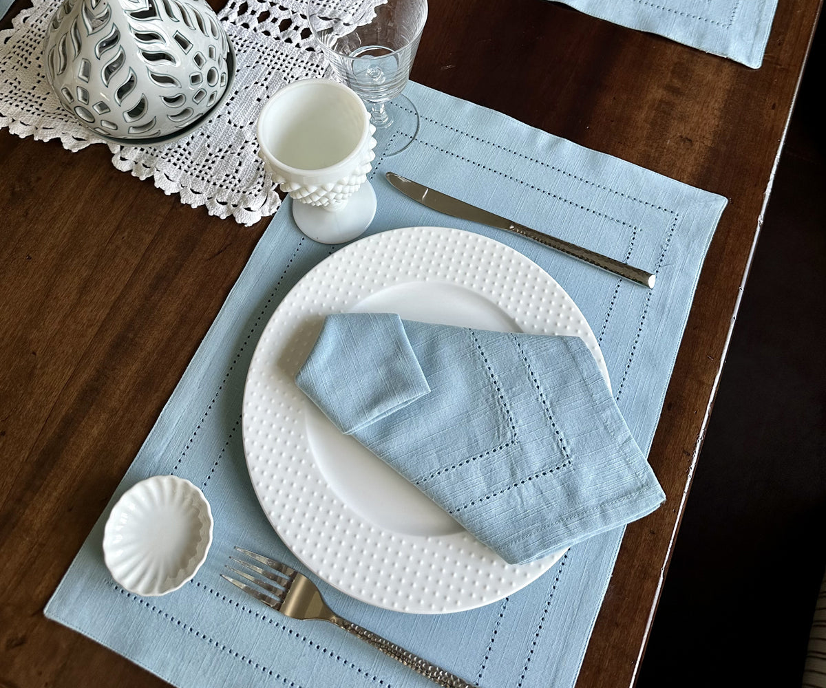Elevate your table decor with stylish blue pattern placemats, showcasing a trendy buffalo plaid design for a chic and practical dining upgrade